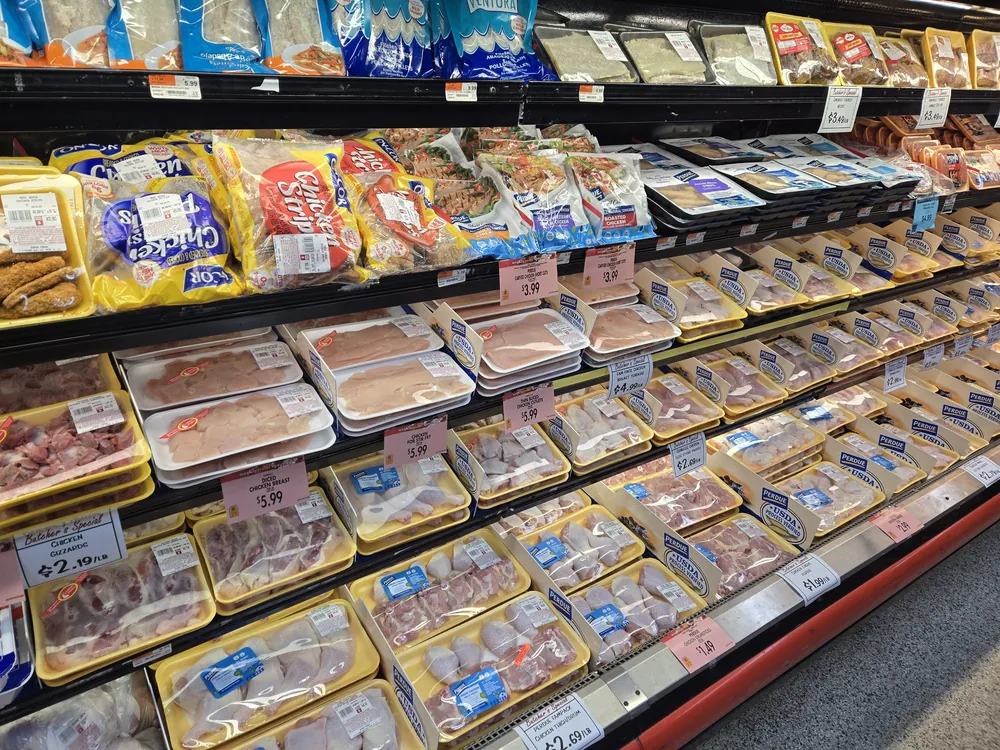 The fresh meat case at SuperFresh Supermarket, stocked with chicken, pork and beef